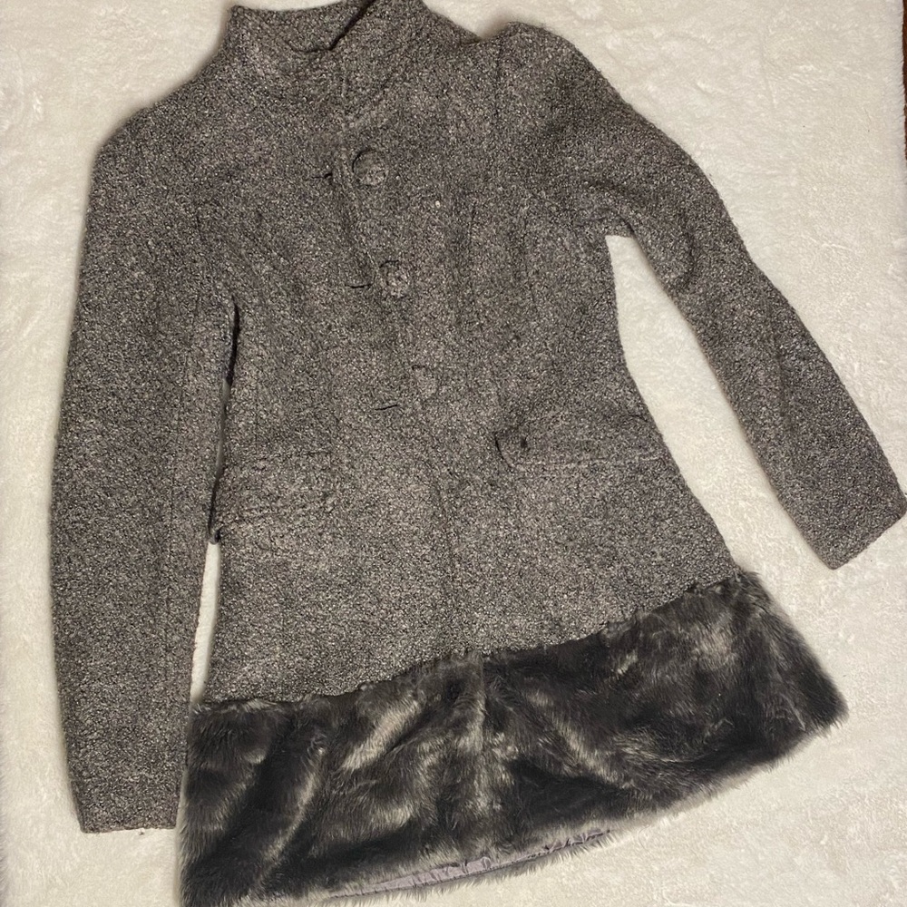 Gray wool coat with faux fur bottom trim.